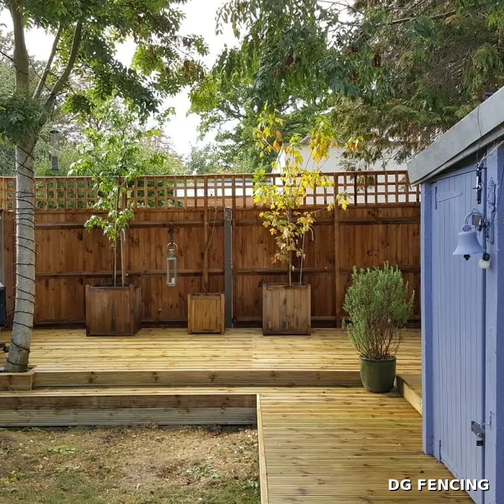 After: finished garden decking with planters, screens and lanterns