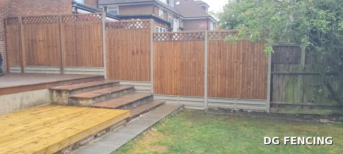 Trellis-top fencing installed around new decking and garden steps