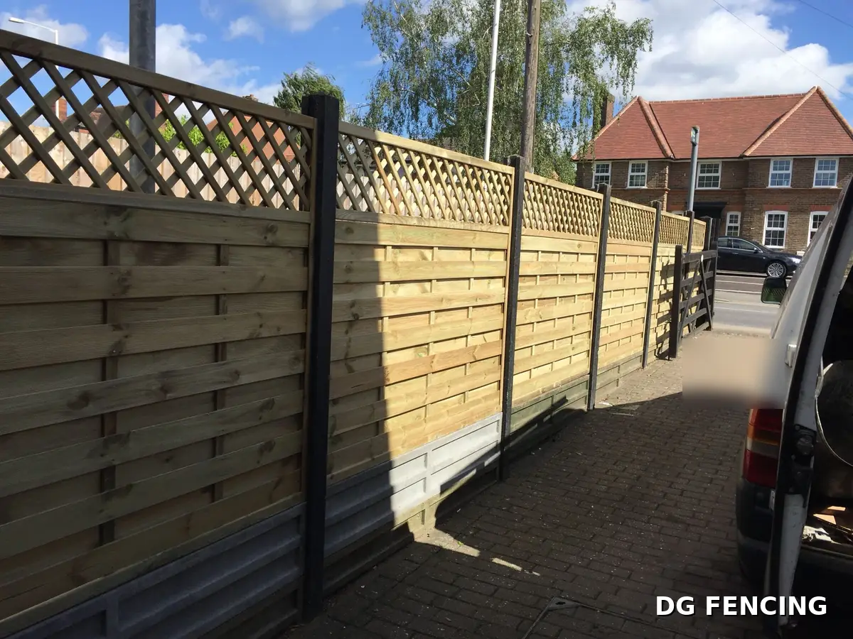 Horizontal weave fence panels with lattice trellis tops in bright sunshine