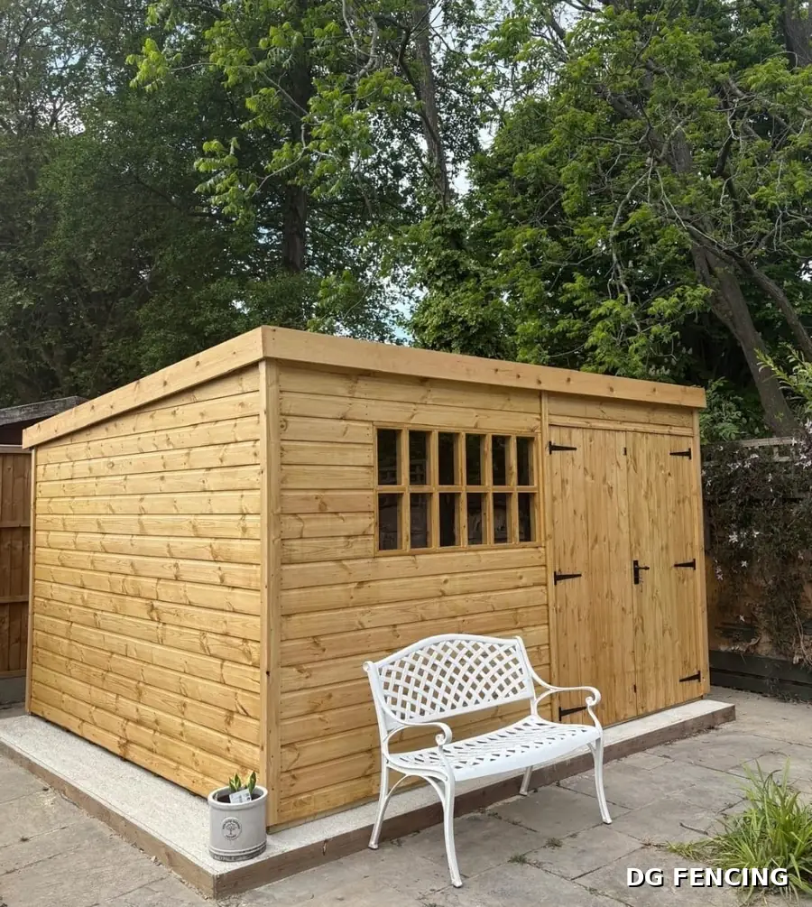 New timber garden shed with pent roof and glazed window on a level base